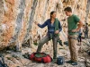 How to Find a Climbing Mentor Who Actually Shows Up Experienced climber coaching younger partner at outdoor sport crag