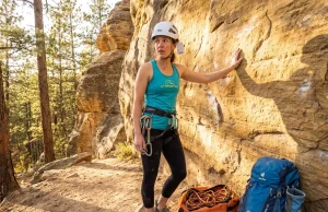 Why Your Gym Grade Means Nothing on Real Rock Gym climber touching real rock outdoors for the first time at a sport crag