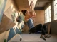 Why Volumes Won’t Replace Your Training Board Climber training on hangboard next to colorful gym volumes on wall