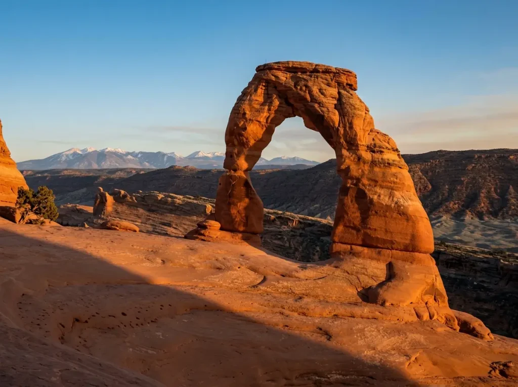 Delicate Arch in Arches National Park at sunset, the protected landmark at the center of climbing ethics