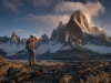 How Hard Is Fitz Roy to Climb? Harder Than It Looks Climber on the approach below Cerro Fitz Roy's granite tower at first light, Patagonia