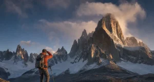 How Hard Is Fitz Roy to Climb? Harder Than It Looks Climber on the approach below Cerro Fitz Roy's granite tower at first light, Patagonia