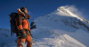 Which Everest Route Is Right for You? Start Here Climber on a fixed rope high on Mount Everest at dawn, weighing which route to climb