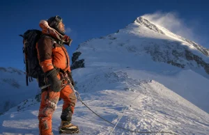 Which Everest Route Is Right for You? Start Here Climber on a fixed rope high on Mount Everest at dawn, weighing which route to climb