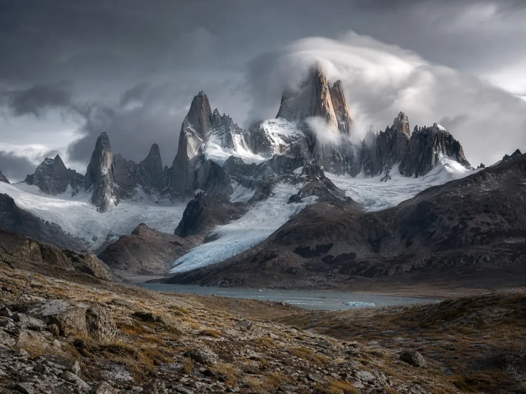 Cerro Fitz Roy massif and granite spires with the smoking-mountain cloud cap forming