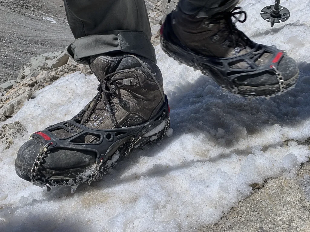 Kahtoola MICROspikes on hiking boots crossing a firm snow patch on the Mount Whitney switchbacks