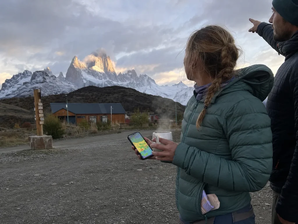 Climbers reading the sky for a weather window on Fitz Roy from El Chaltén